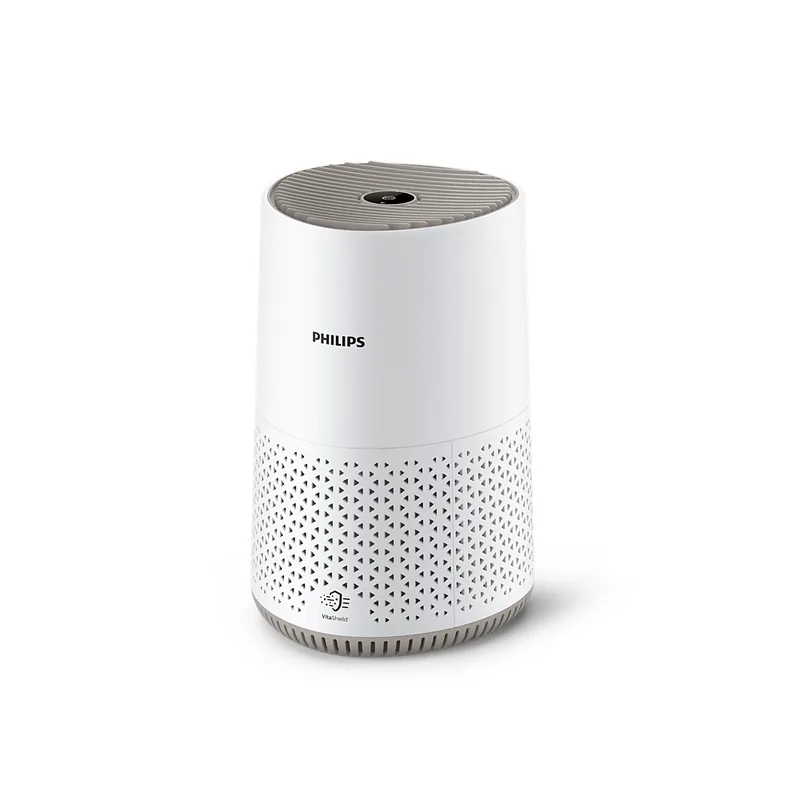 เครื่องฟอกอากาศ Philips 600i Series AC0650/10 ทรงกระบอกสีขาว ฝาบนสีเบจ ส่วนล่างเจาะรูสามเหลี่ยม มุมเฉียงด้านหน้า